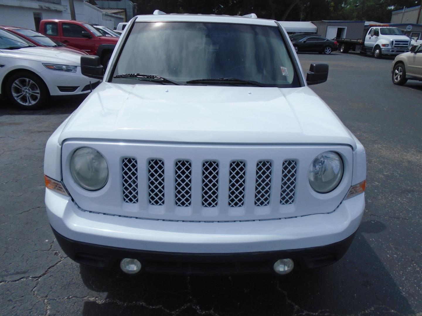 2014 Jeep Patriot Latitude 2WD (1C4NJPFA5ED) with an 2.0L L4 DOHC 16V engine, located at 6112 N Florida Avenue, Tampa, FL, 33604, (888) 521-5131, 27.954929, -82.459534 - Photo#1